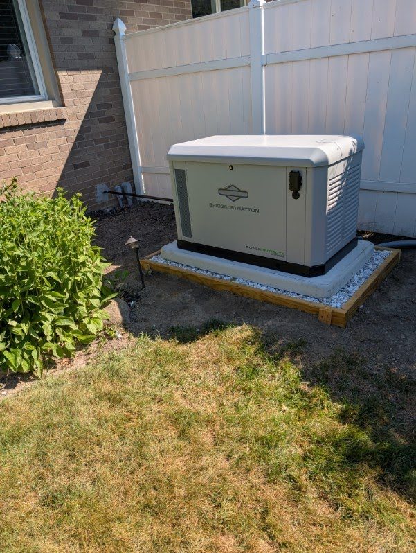 A Briggs & Stratton standby generator installed by VECA beside a home