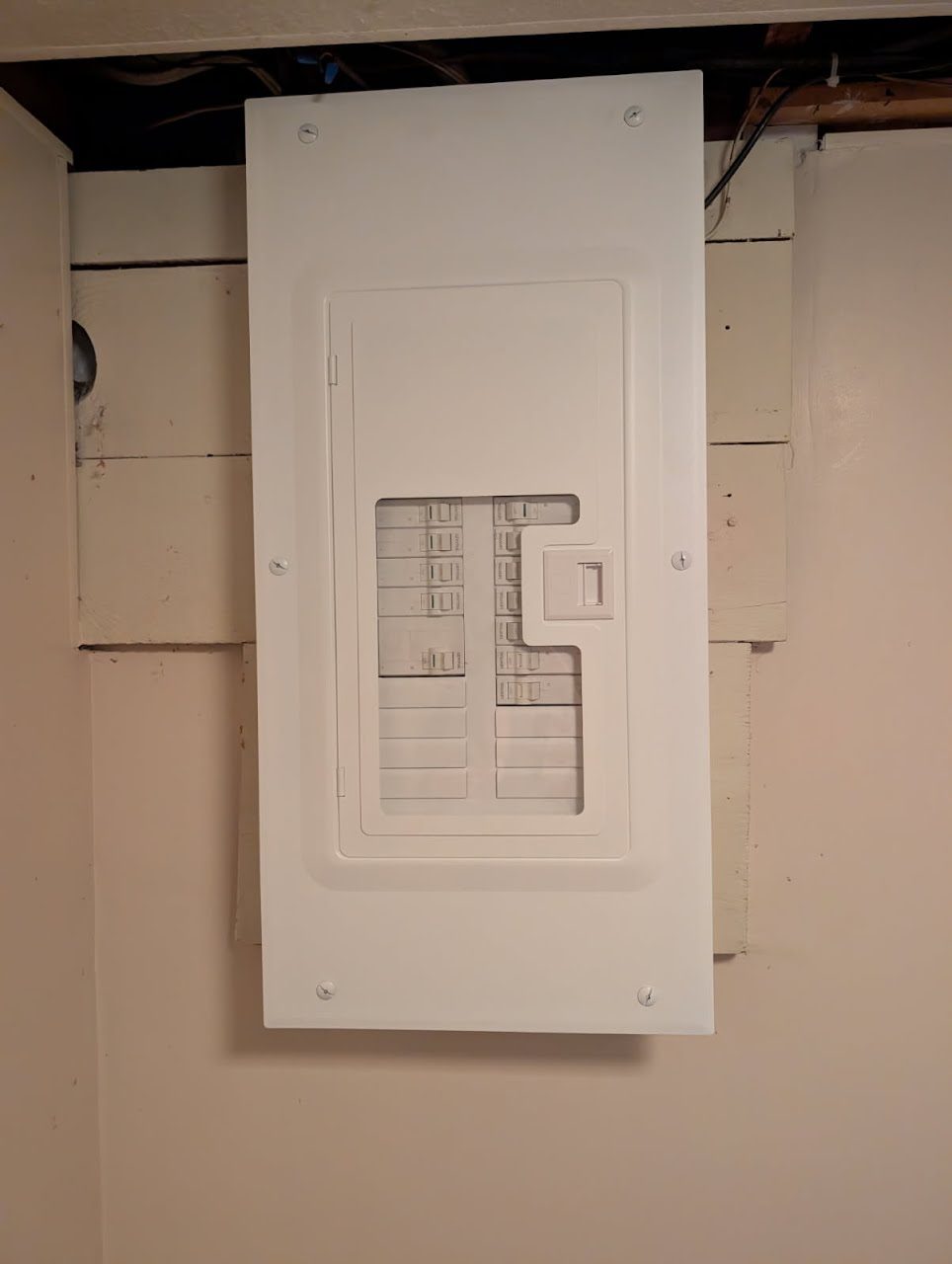 A finished breaker panel in a home basement, installed by VECA